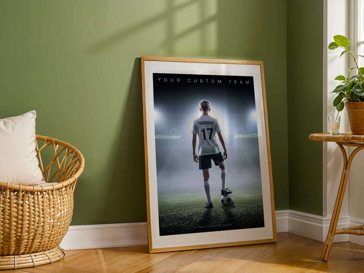 Coach placing a newly gifted poster on the wall of an office, showing where a visual keepsake naturally fits into daily life