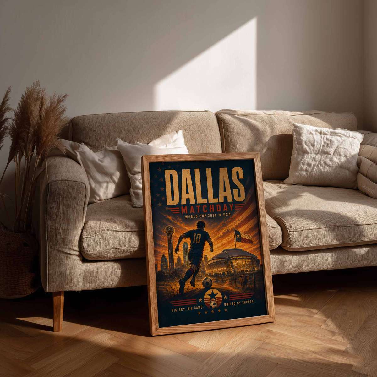 Framed World Cup 2026 poster displayed on a living room wall above a sofa, showcasing how it integrates into home decor